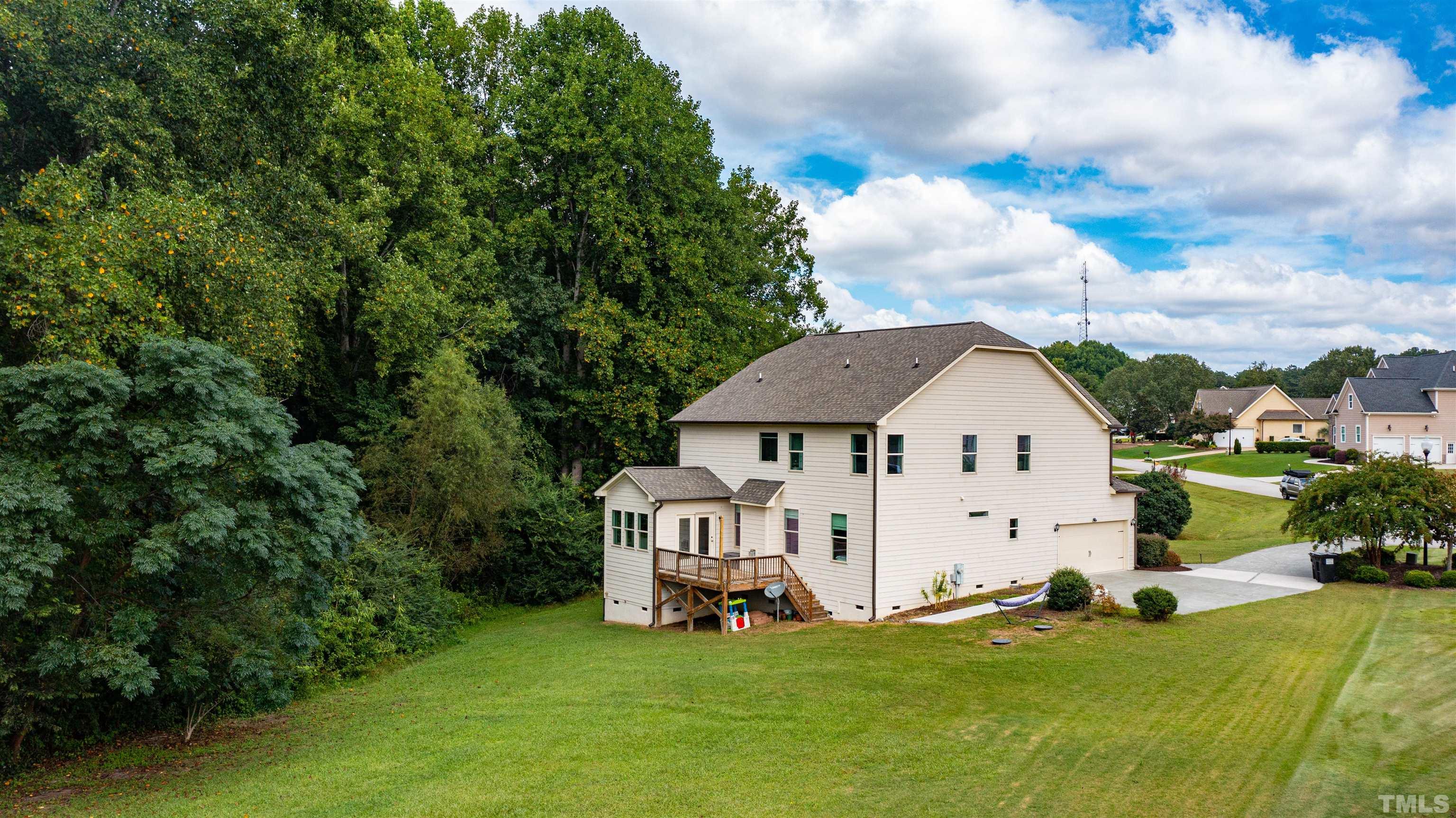 8340 Yellow Aster Court Willow Spring, NC 27592 - Photo 31 of 35 a view of a house with a yard and sitting area