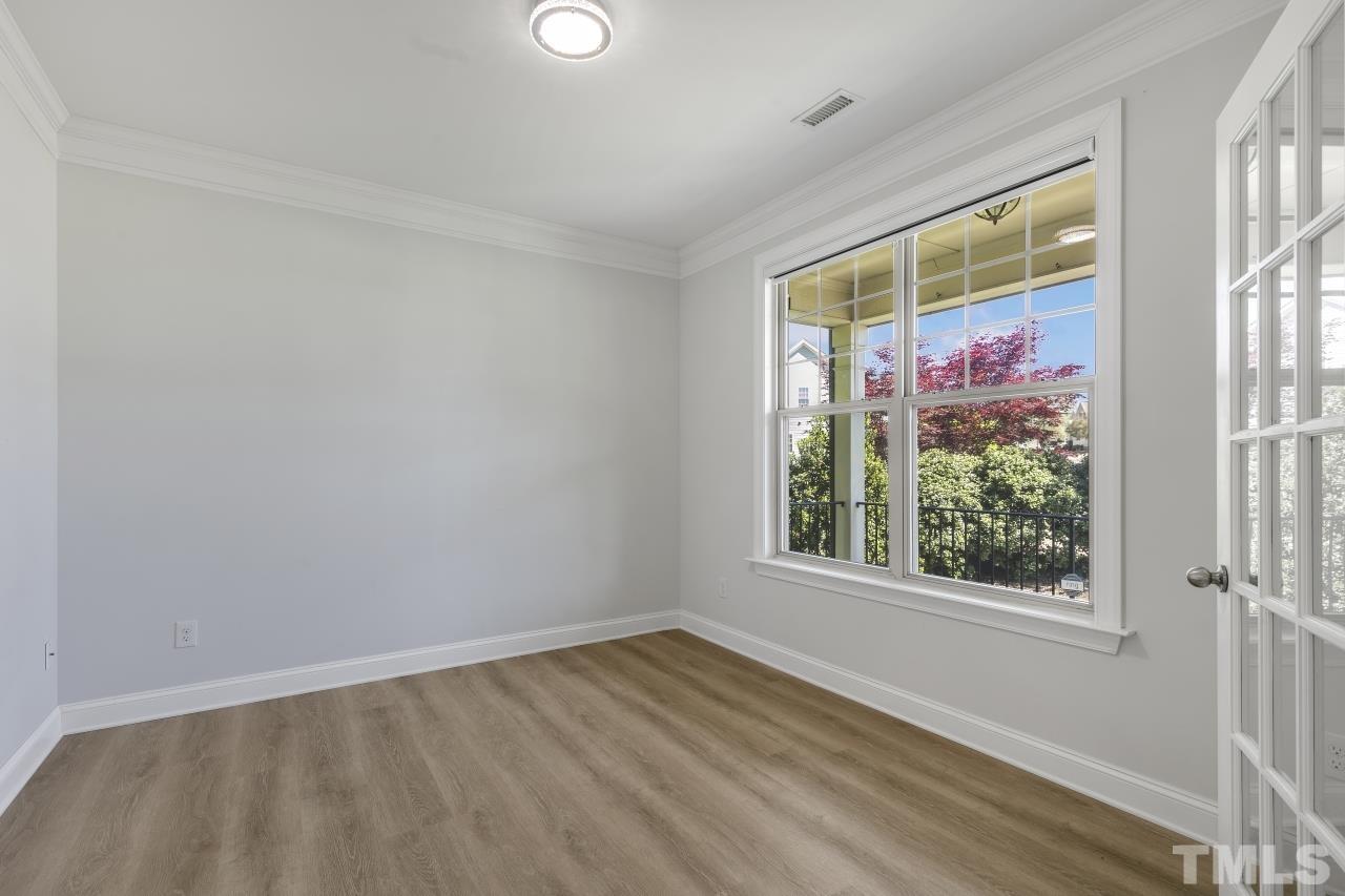8340 Yellow Aster Court Willow Spring, NC 27592 - Photo 4 of 35 an empty room with a window