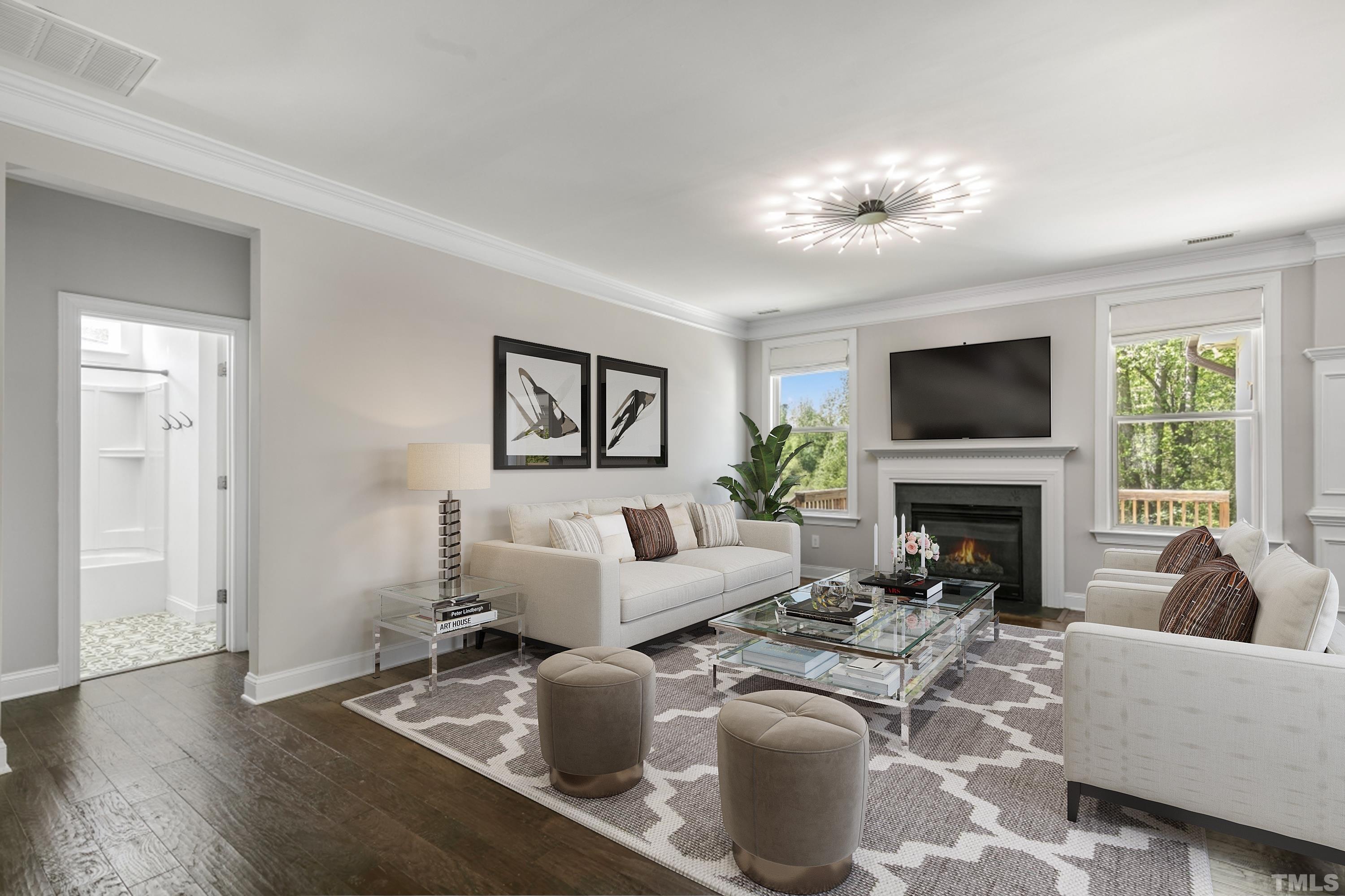 8340 Yellow Aster Court Willow Spring, NC 27592 - Photo 8 of 35 a living room with furniture a large window and a fireplace