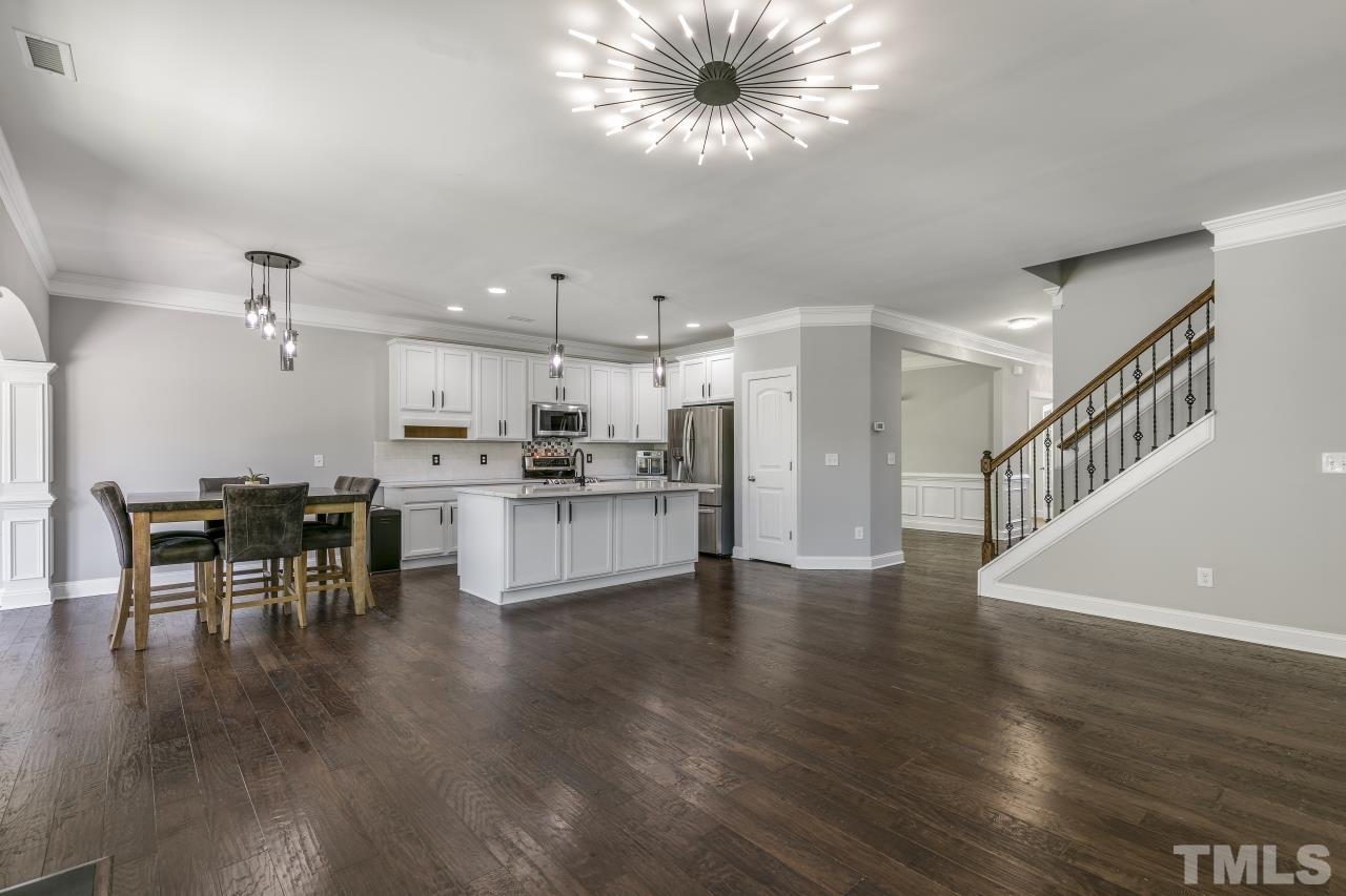 8340 Yellow Aster Court Willow Spring, NC 27592 - Photo 10 of 35 a view of kitchen with cabinets and wooden floor