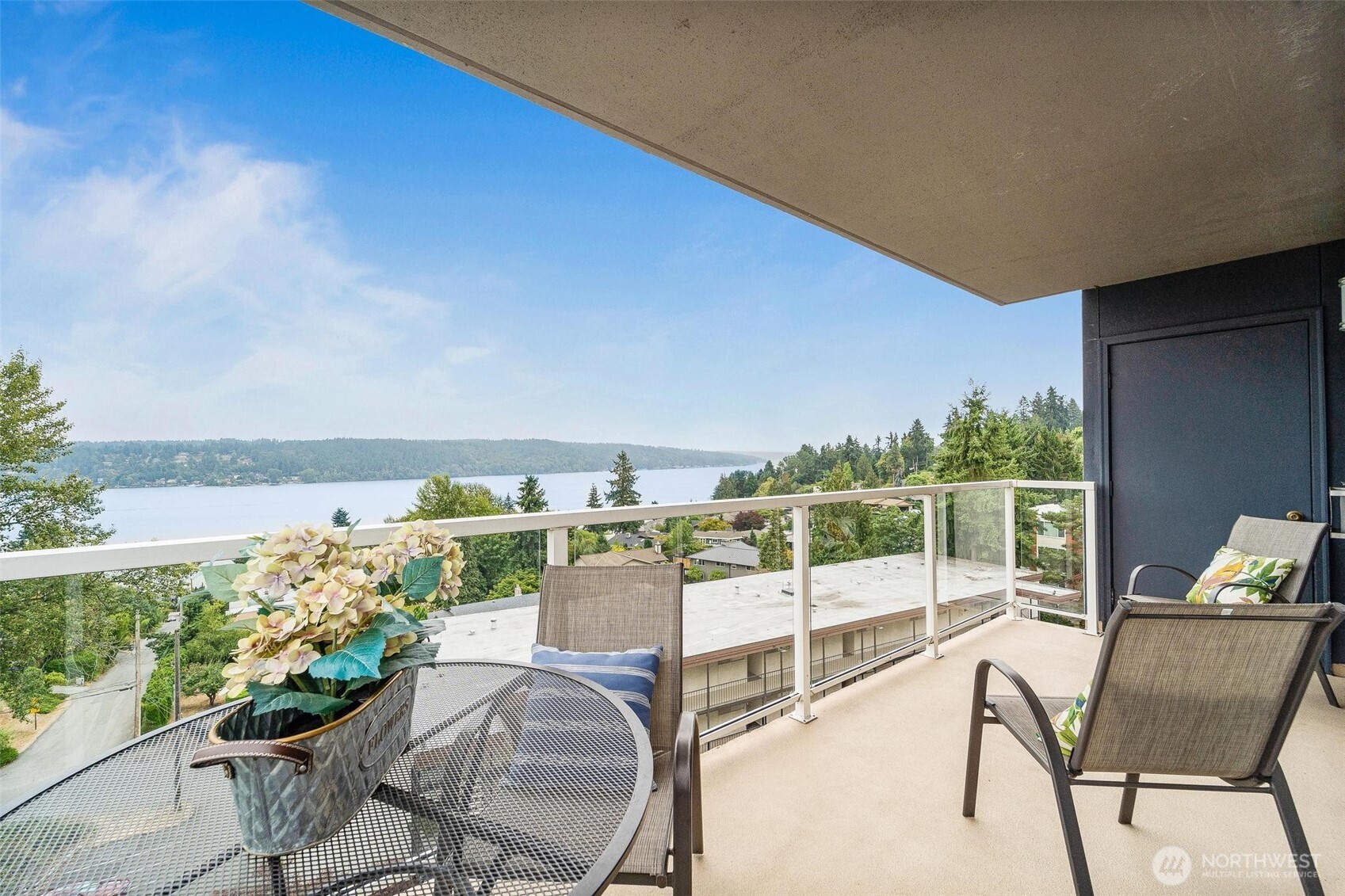a view of a chairs and table in patio