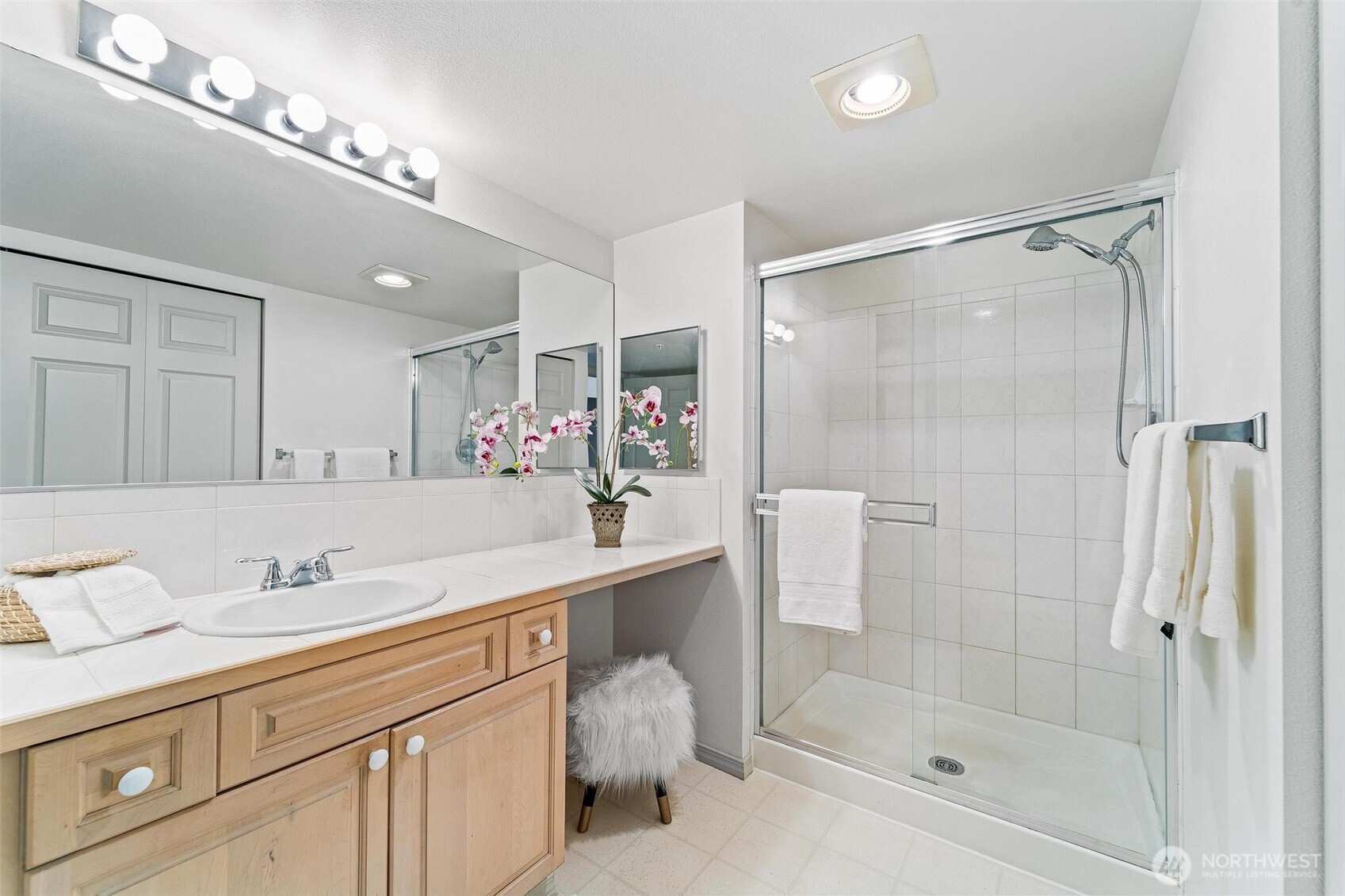 15020 Bothell Way Northeast, Unit 502 Lake Forest Park, WA 98155 - Photo 15 of 30 a bathroom with a shower sink vanity granite and shower