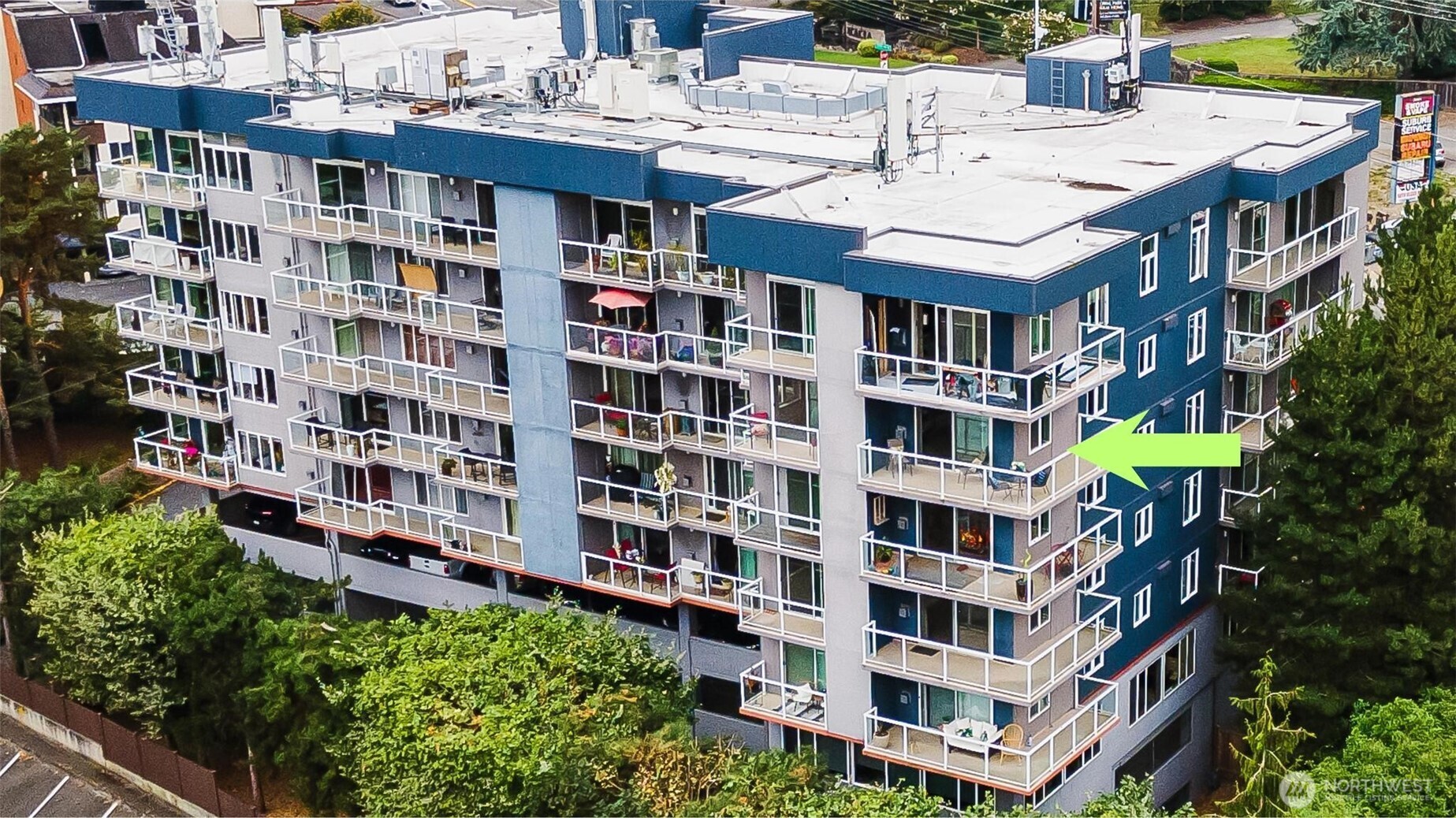 15020 Bothell Way Northeast, Unit 502 Lake Forest Park, WA 98155 - Photo 2 of 30 a view of a tall building in the middle of a city street