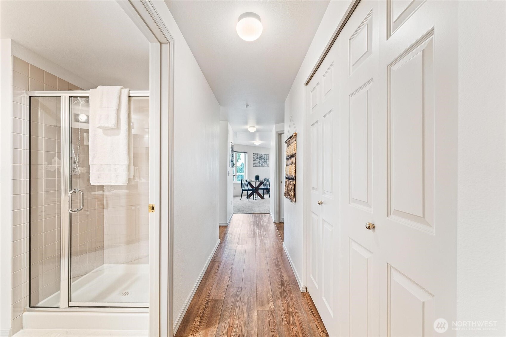 15020 Bothell Way Northeast, Unit 502 Lake Forest Park, WA 98155 - Photo 21 of 30 a view of a hallway with wooden floor and staircase
