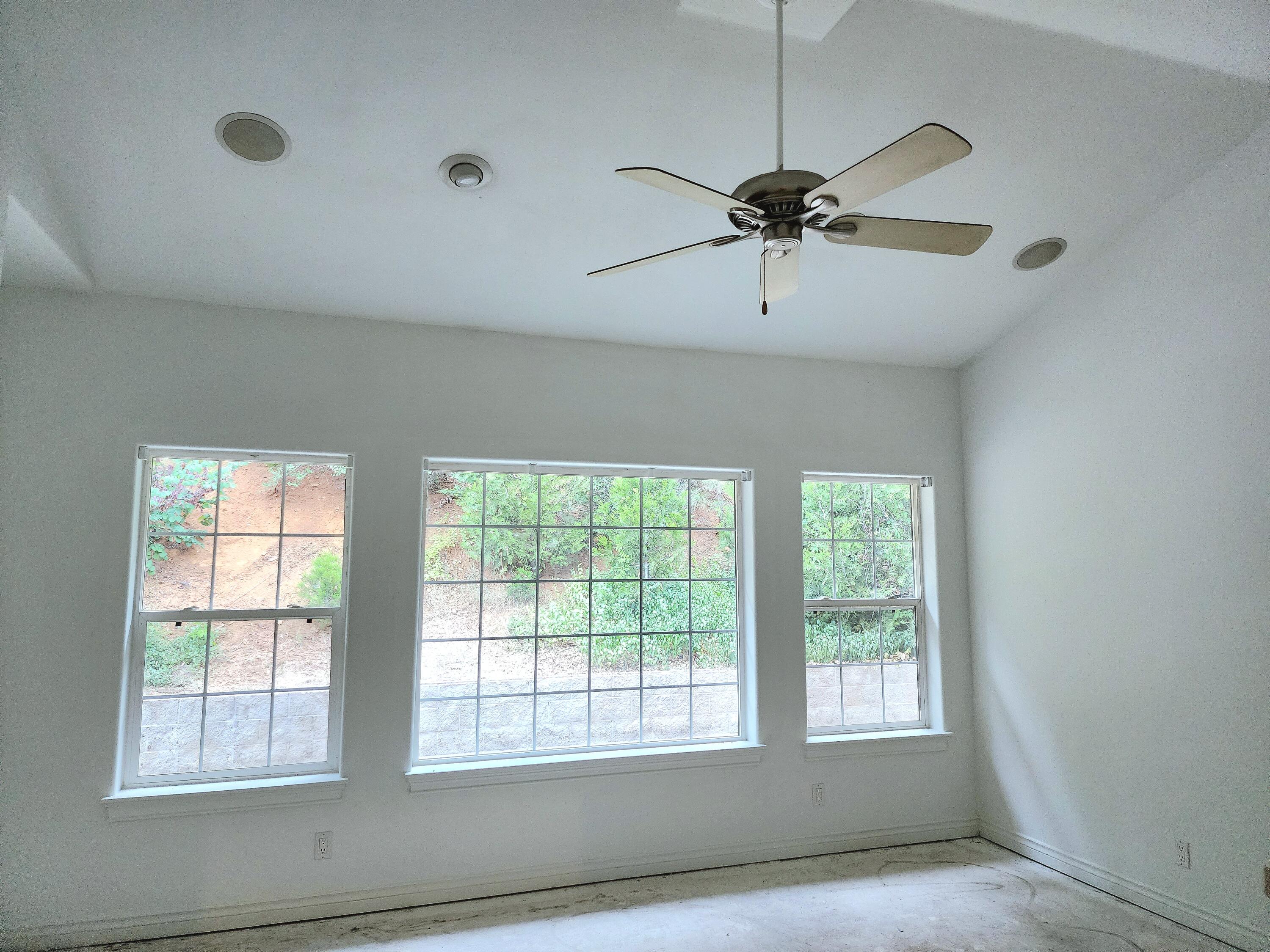370 34N96 Lewiston, CA 96052 - Photo 18 of 30 a view of a livingroom with a window and a ceiling fan