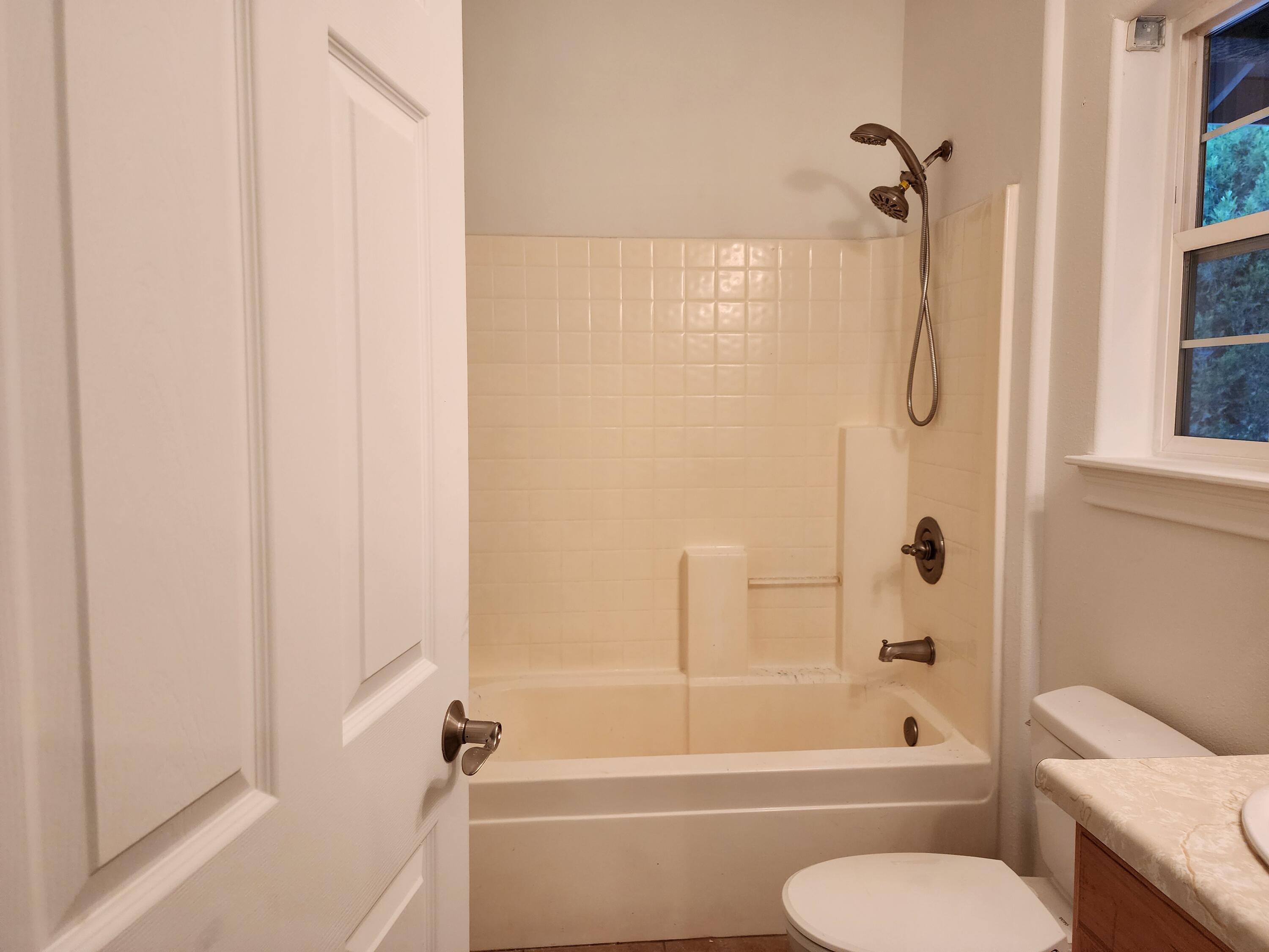 370 34N96 Lewiston, CA 96052 - Photo 23 of 30 a bathroom with a toilet and a bath tub