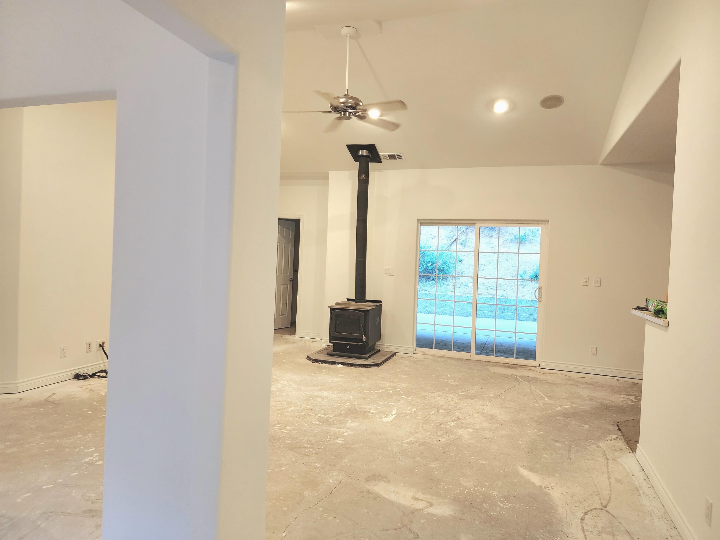 370 34N96 Lewiston, CA 96052 - Photo 8 of 30 a view of a livingroom with a ceiling fan and window