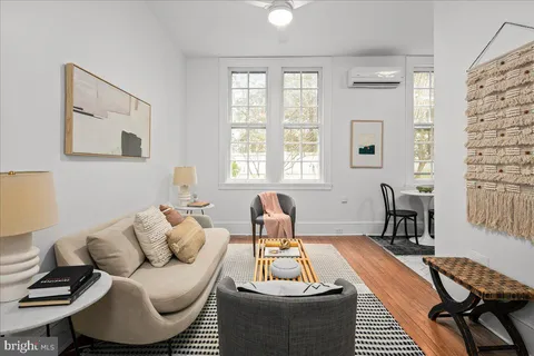 a living room with furniture and a window