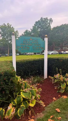 a view of a garden with lawn chairs