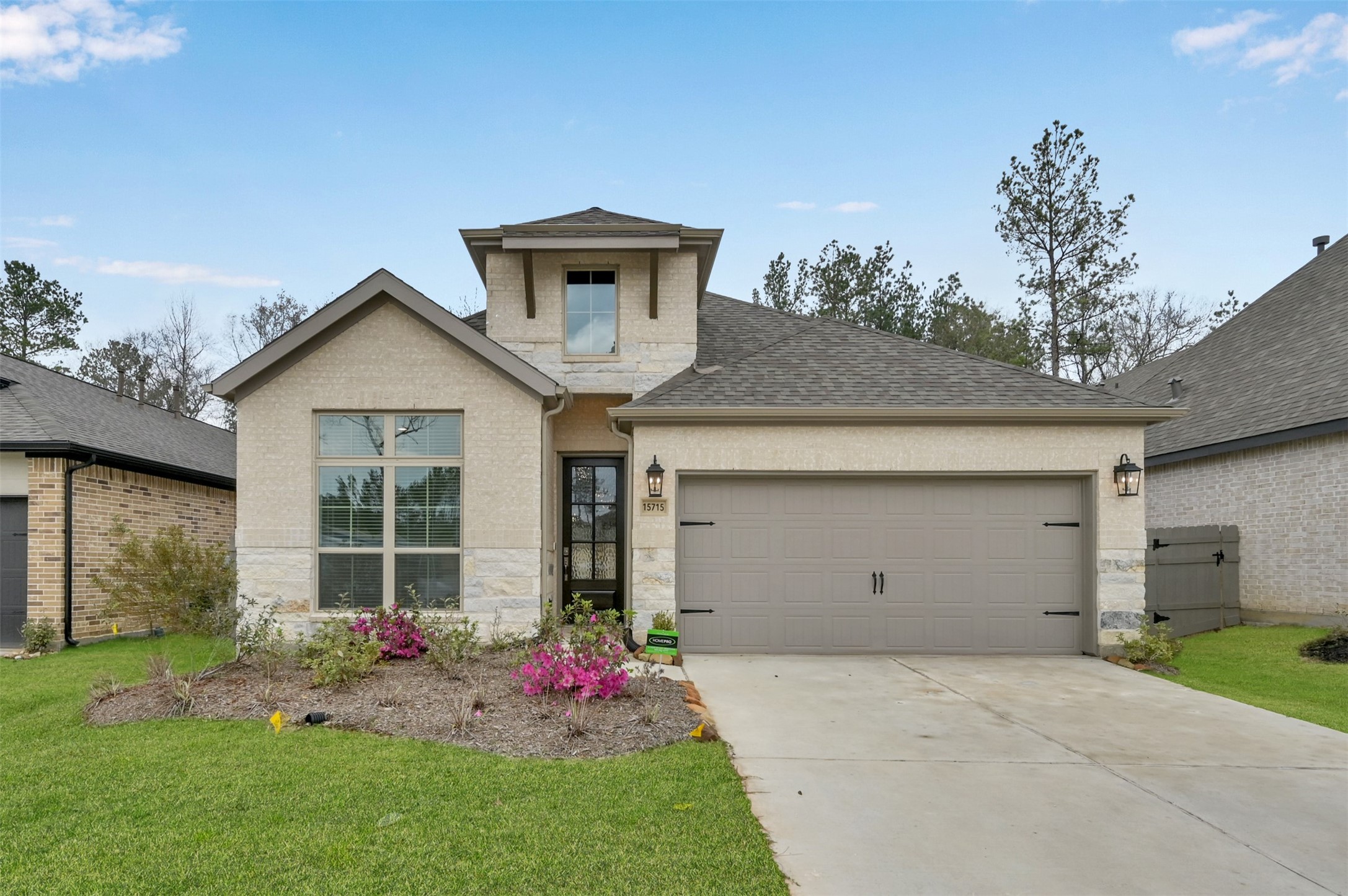 15715 Autumn Sun Conroe, TX 77302 - Photo 1 of 23 a front view of a house with garden