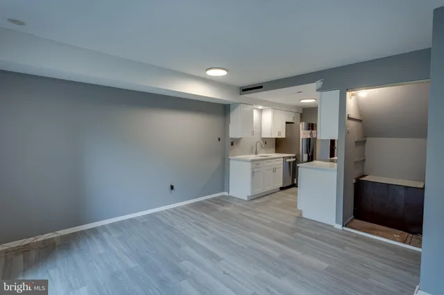 a view of kitchen with refrigerator microwave and stove