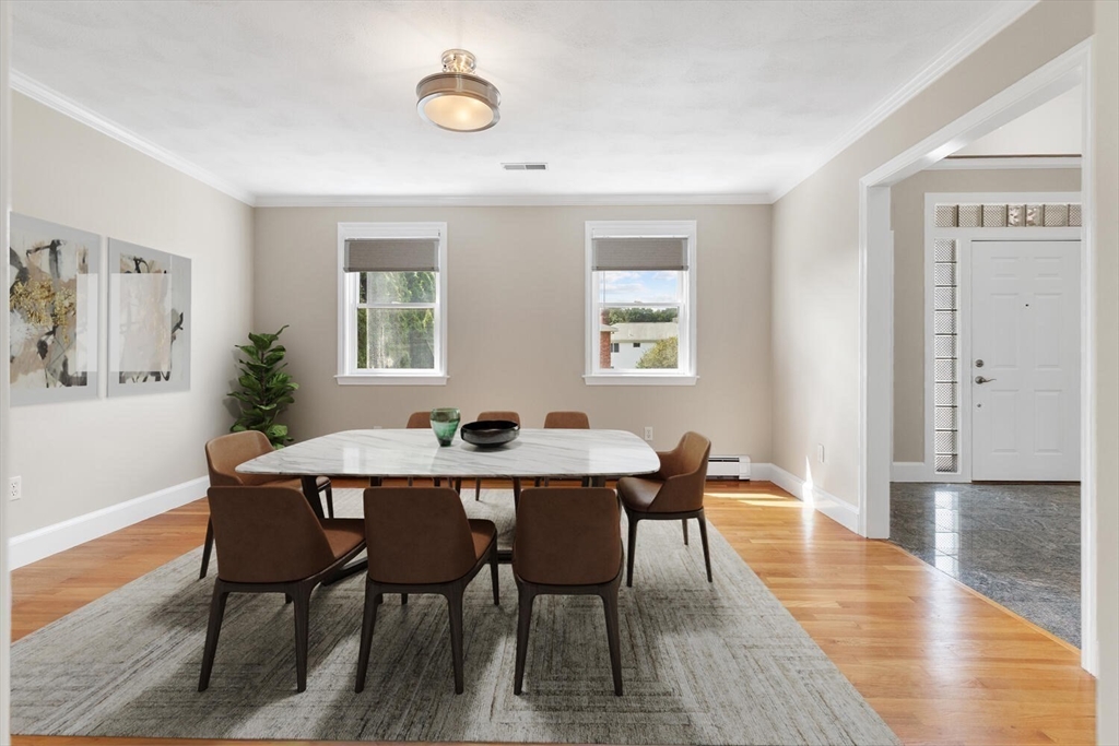4 Gavin Circle Stoneham, MA 02180 - Photo 11 of 22 a view of a dining room with furniture and wooden floor