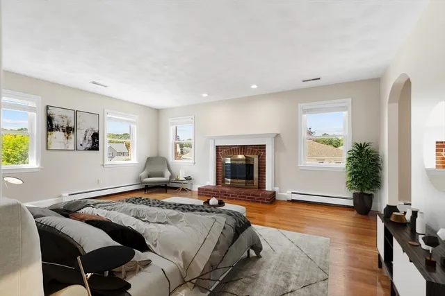 a bedroom with a bed and a fireplace