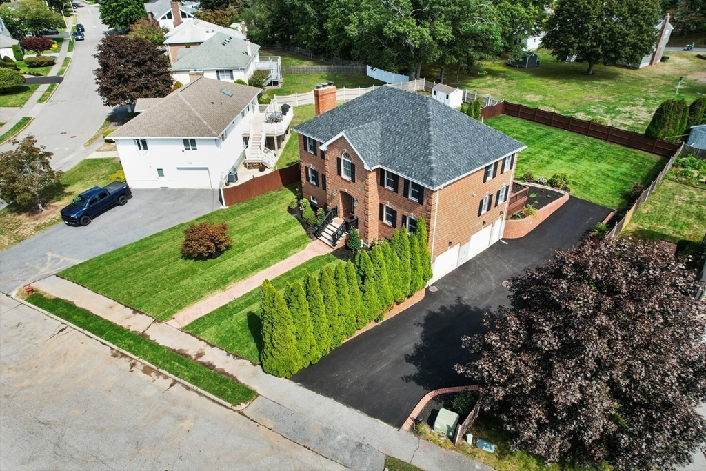 4 Gavin Circle Stoneham, MA 02180 - Photo 4 of 22 an aerial view of a house with a garden and trees