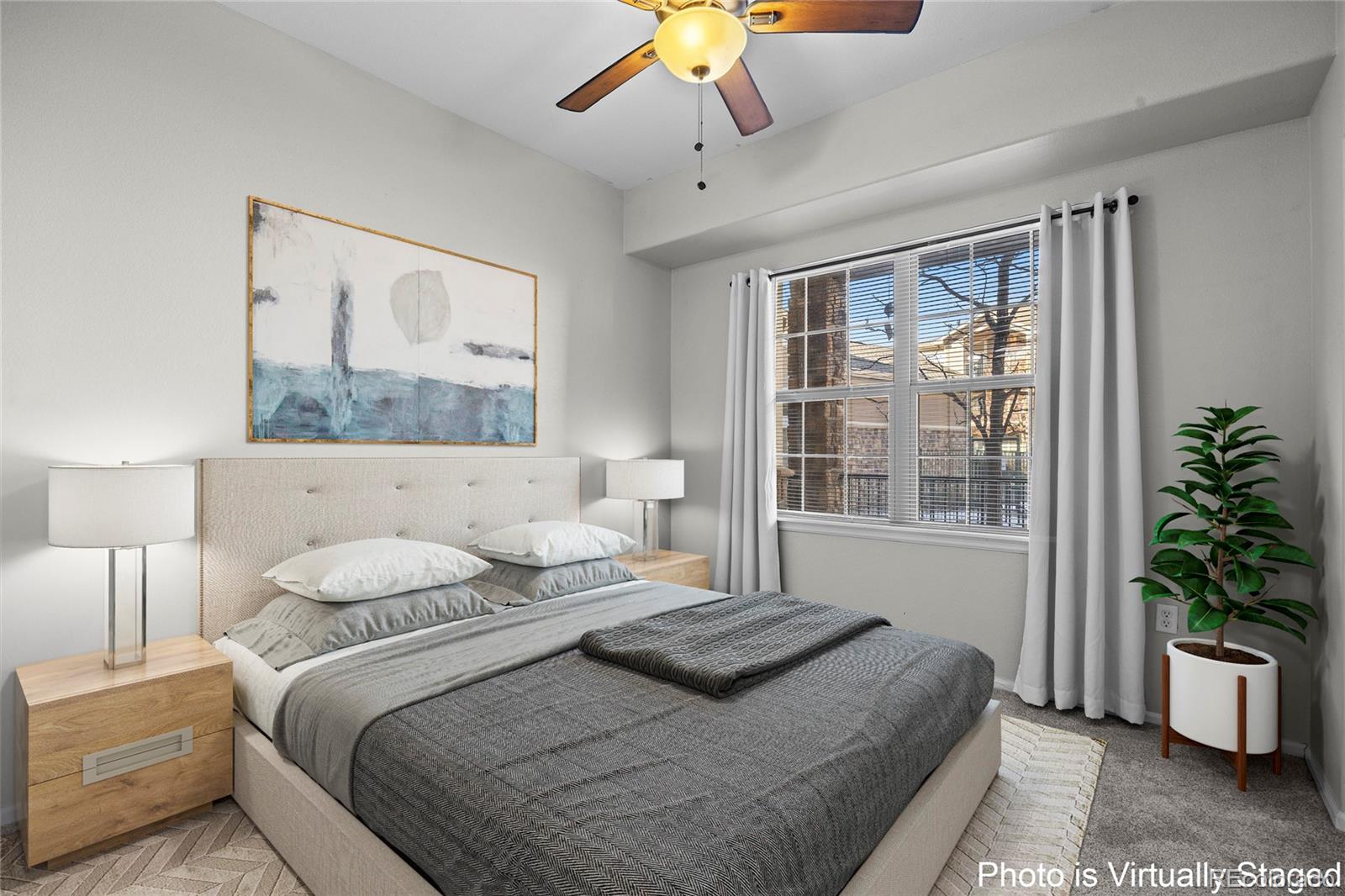 10805 Twenty Mile Road, Unit 104 Parker, CO 80134 - Photo 18 of 43 a bedroom with a large bed and a potted plant