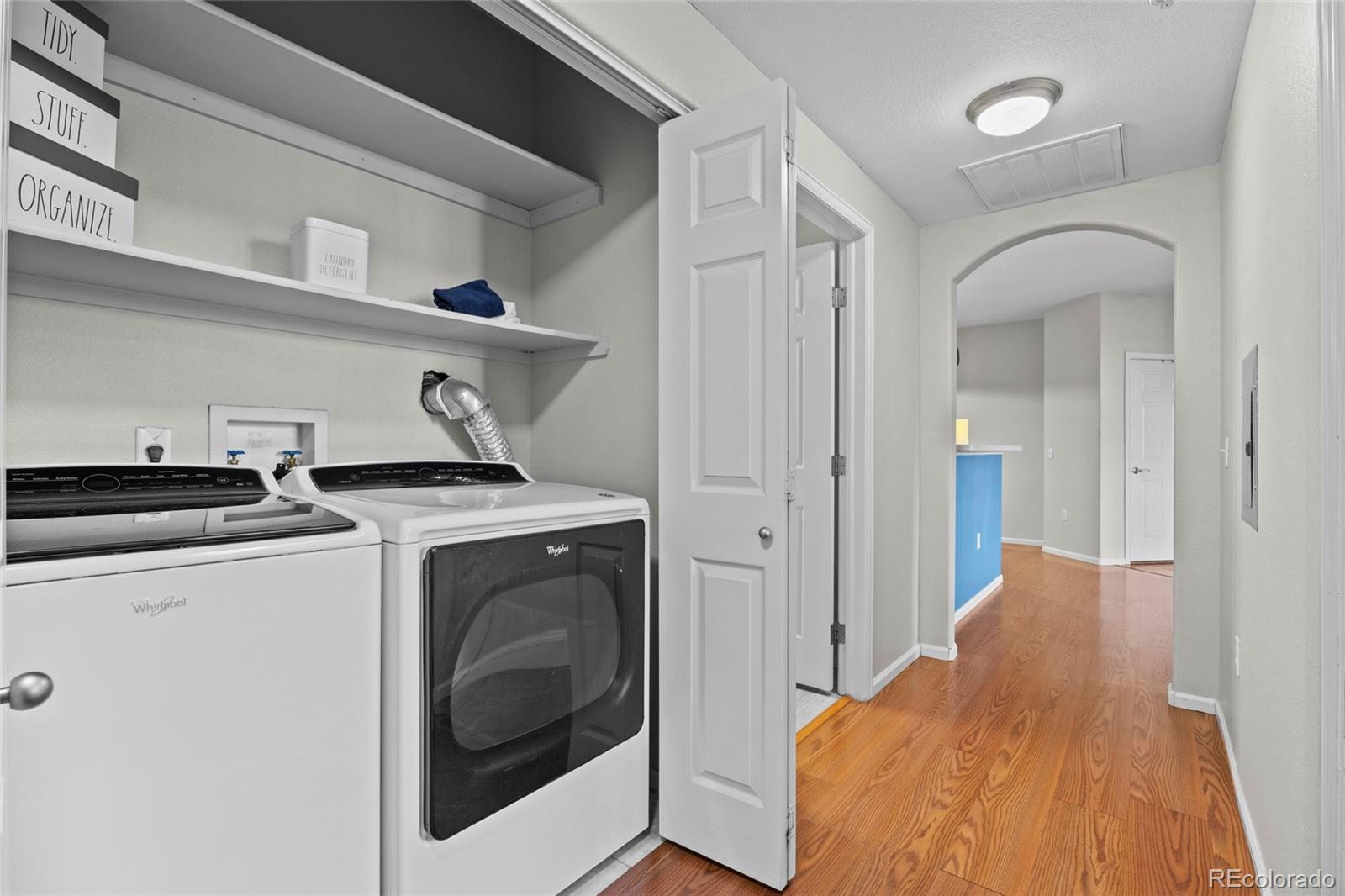 10805 Twenty Mile Road, Unit 104 Parker, CO 80134 - Photo 22 of 43 a view of a hallway with washer and dryer