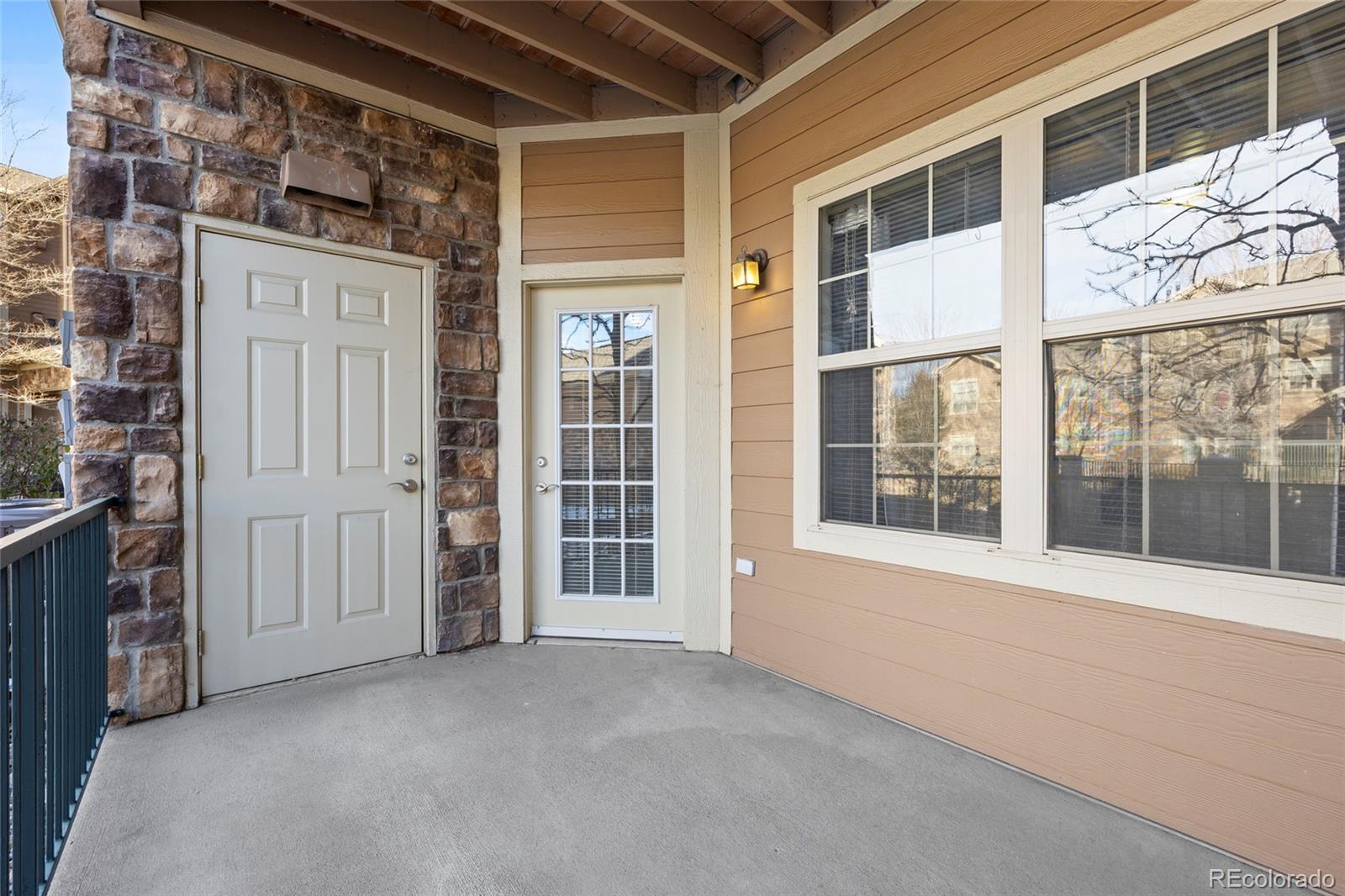 10805 Twenty Mile Road, Unit 104 Parker, CO 80134 - Photo 25 of 43 front view of an buildings with a glass door