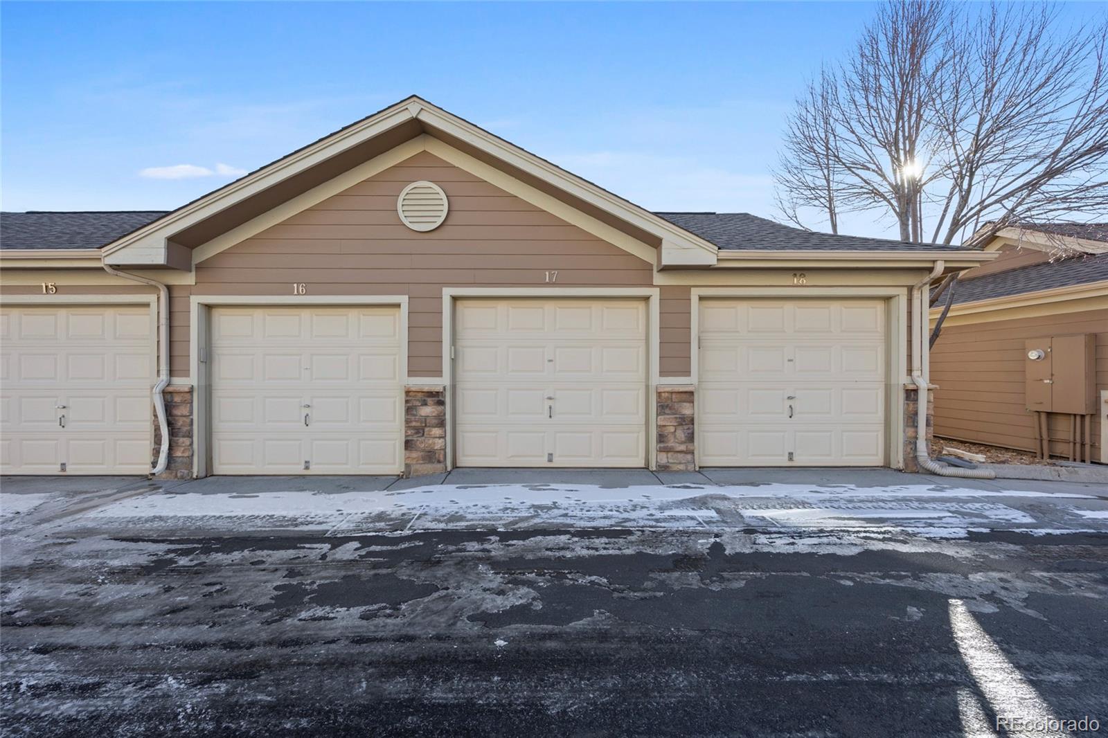 10805 Twenty Mile Road, Unit 104 Parker, CO 80134 - Photo 27 of 43 a front view of a house with a yard