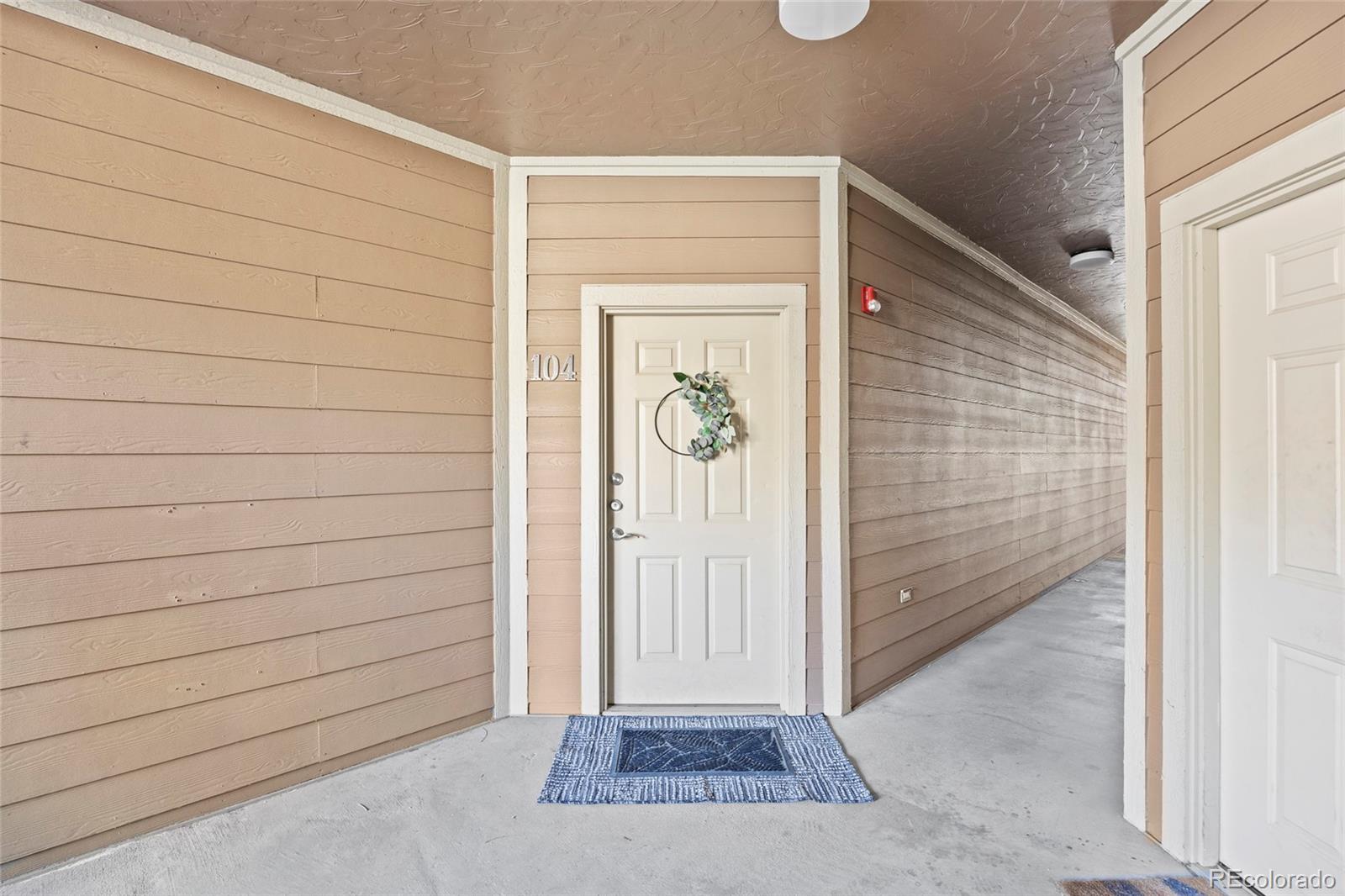 10805 Twenty Mile Road, Unit 104 Parker, CO 80134 - Photo 28 of 43 a view of front door