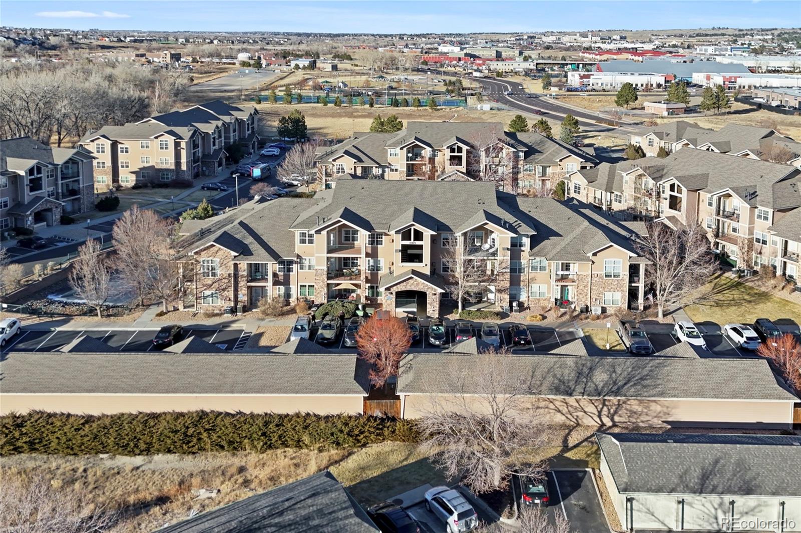 10805 Twenty Mile Road, Unit 104 Parker, CO 80134 - Photo 31 of 43 an aerial view of a house with swimming pool