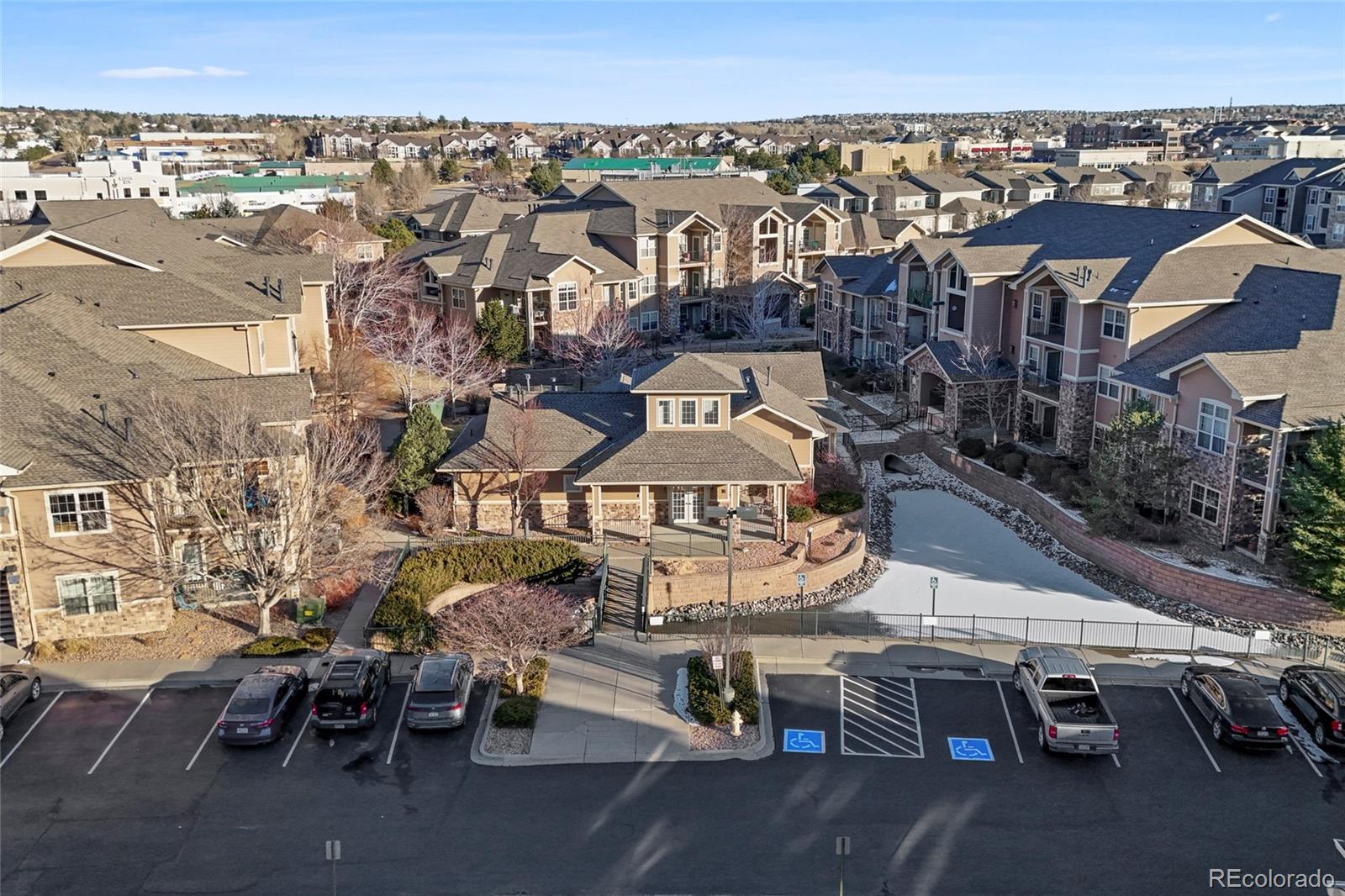 10805 Twenty Mile Road, Unit 104 Parker, CO 80134 - Photo 37 of 43 an aerial view of a building with outdoor space
