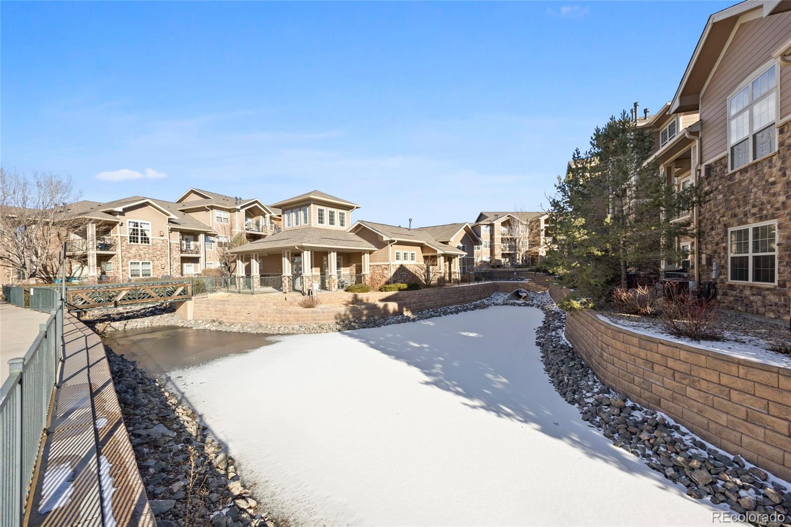 10805 Twenty Mile Road, Unit 104 Parker, CO 80134 - Photo 39 of 43 a view of a city with tall buildings