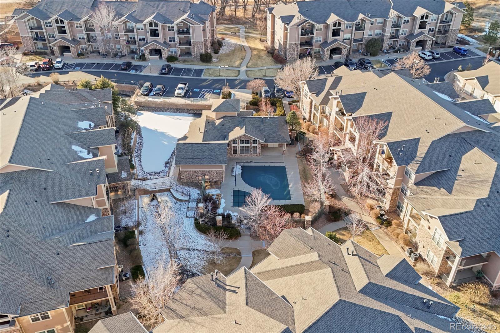 10805 Twenty Mile Road, Unit 104 Parker, CO 80134 - Photo 41 of 43 a picture of a building with outdoor seating