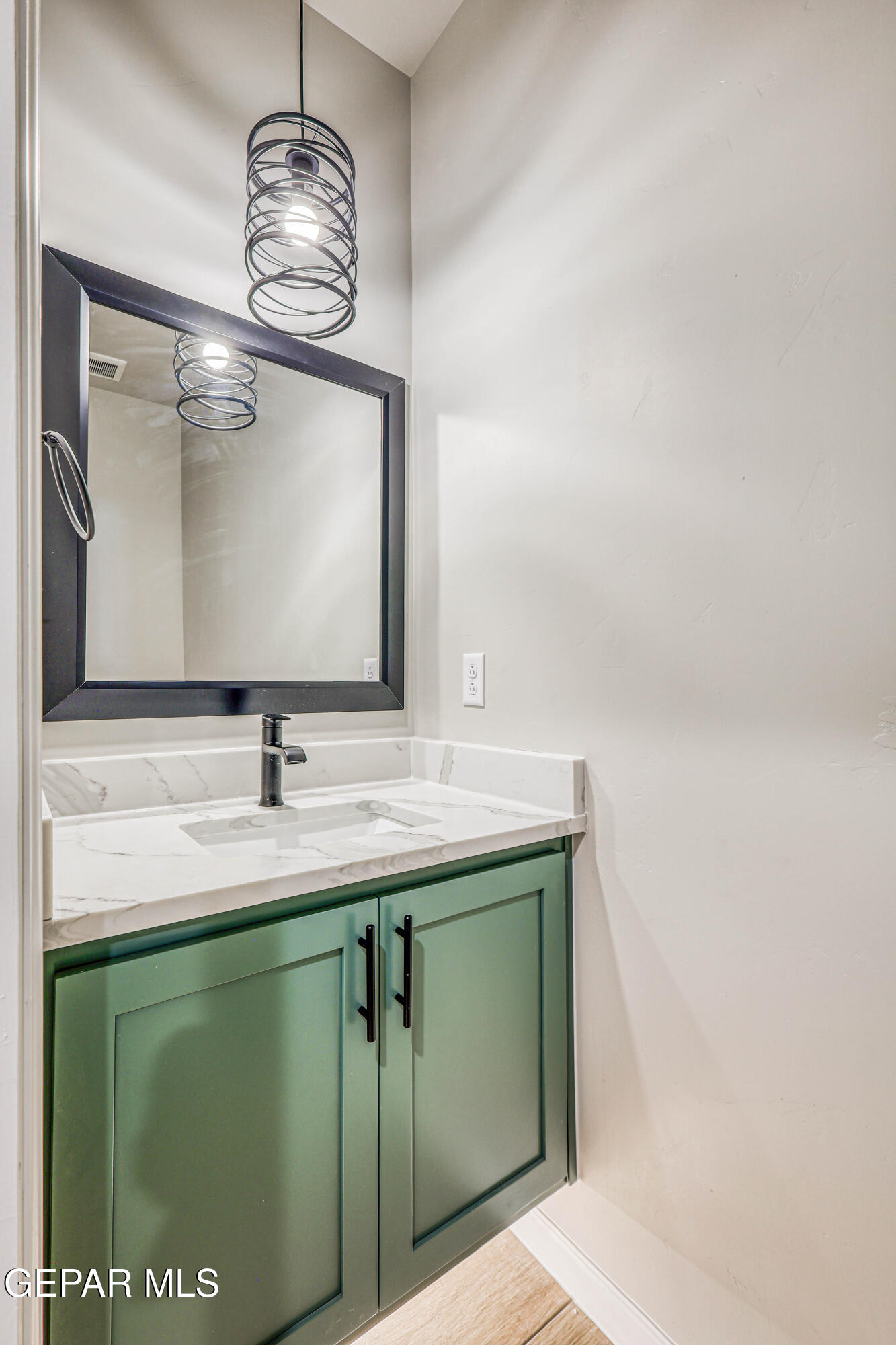 6047 Zinc Hill Street Sunland Park, NM 88008 - Photo 11 of 18 a bathroom with a sink and a mirror
