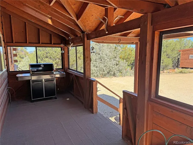 a open kitchen with stainless steel appliances granite countertop a stove a sink and a microwave