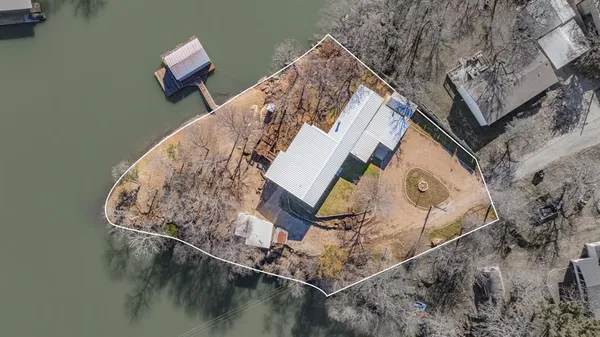 a aerial view of a house with a yard