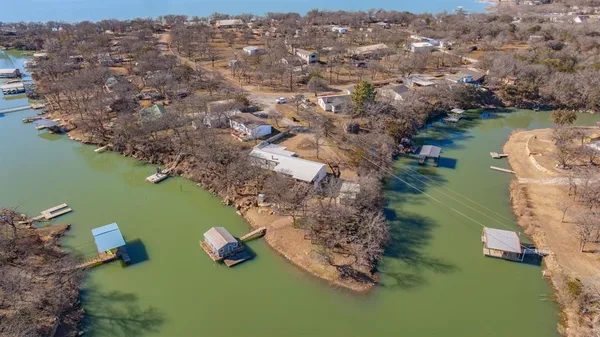 a aerial view of a house with swimming pool next to a yard