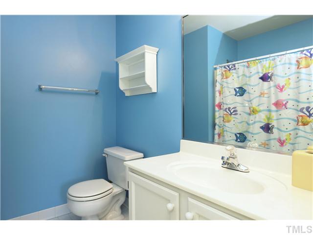 115 Skylark Way Raleigh, NC 27615 - Photo 14 of 17 a bathroom with a sink a toilet and mirror