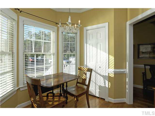 115 Skylark Way Raleigh, NC 27615 - Photo 6 of 17 a view of a dining room with furniture and chandelier