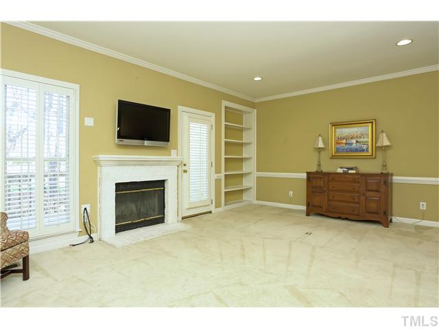 115 Skylark Way Raleigh, NC 27615 - Photo 7 of 17 a living room with furniture flat screen tv and a fireplace