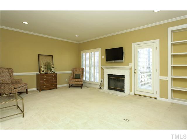 115 Skylark Way Raleigh, NC 27615 - Photo 8 of 17 a living room with furniture and a fireplace