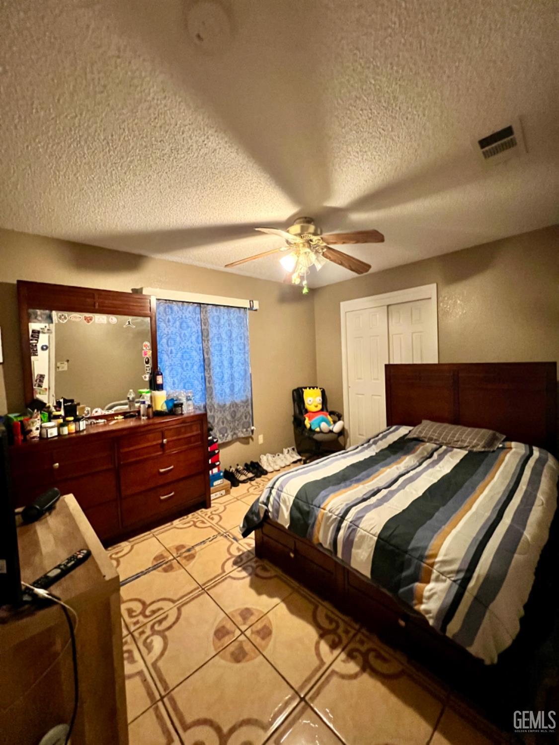 Undisclosed Address Lost Hills, CA 93249 - Photo 8 of 10 a bedroom with a bed and a mirror