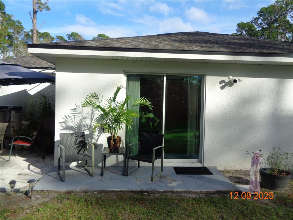2380 8th Avenue DeLand, FL 32724 - Photo 11 of 31 a view of front door and potted plants