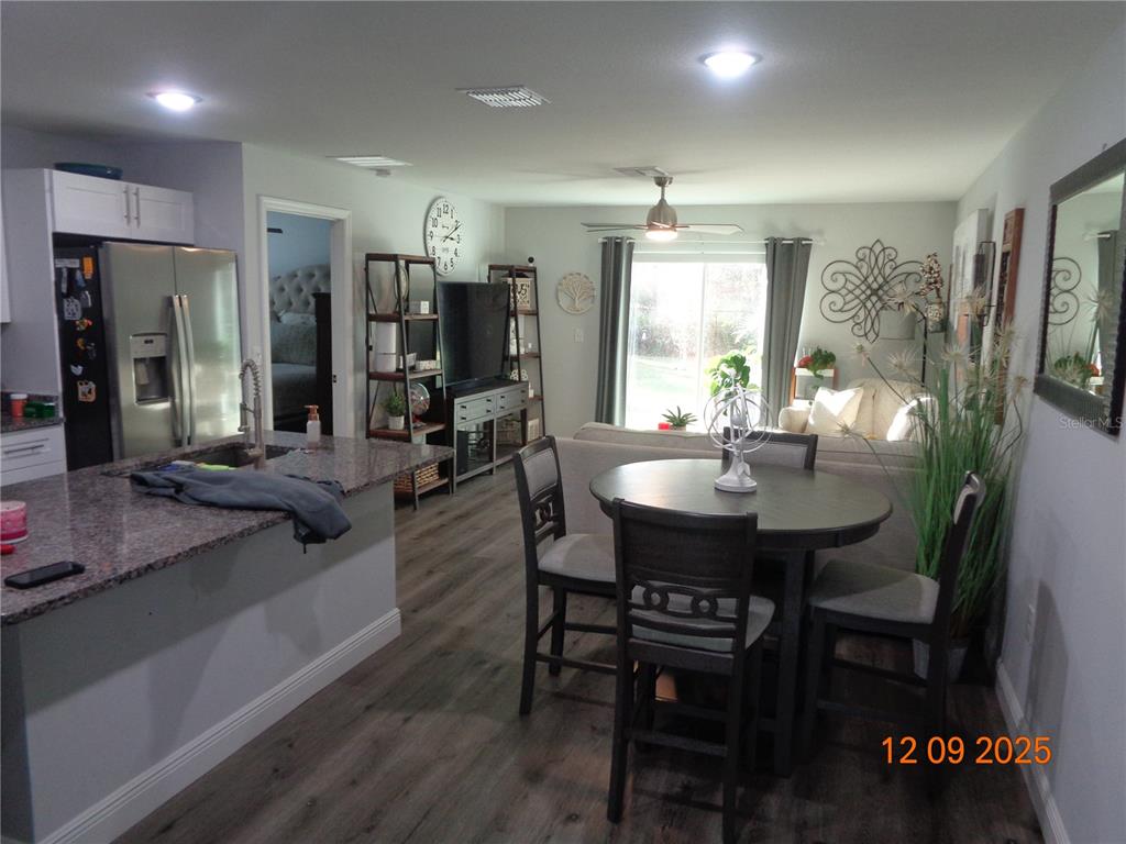 2380 8th Avenue DeLand, FL 32724 - Photo 17 of 31 a view of a dining room with furniture and window