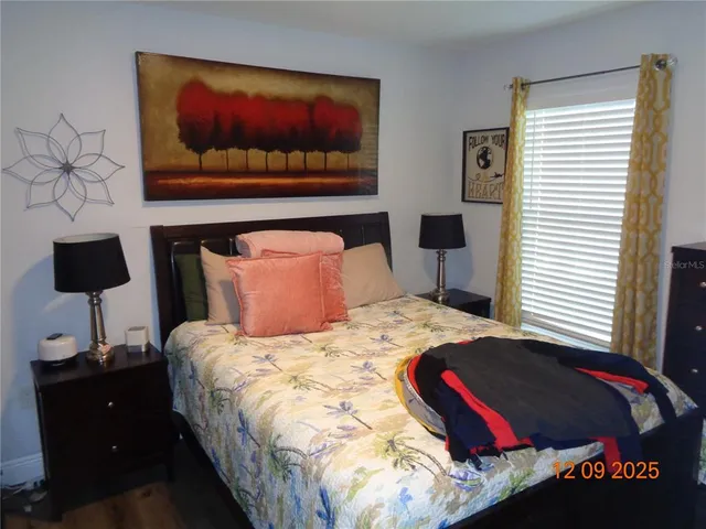 a bedroom with a bed and a dresser