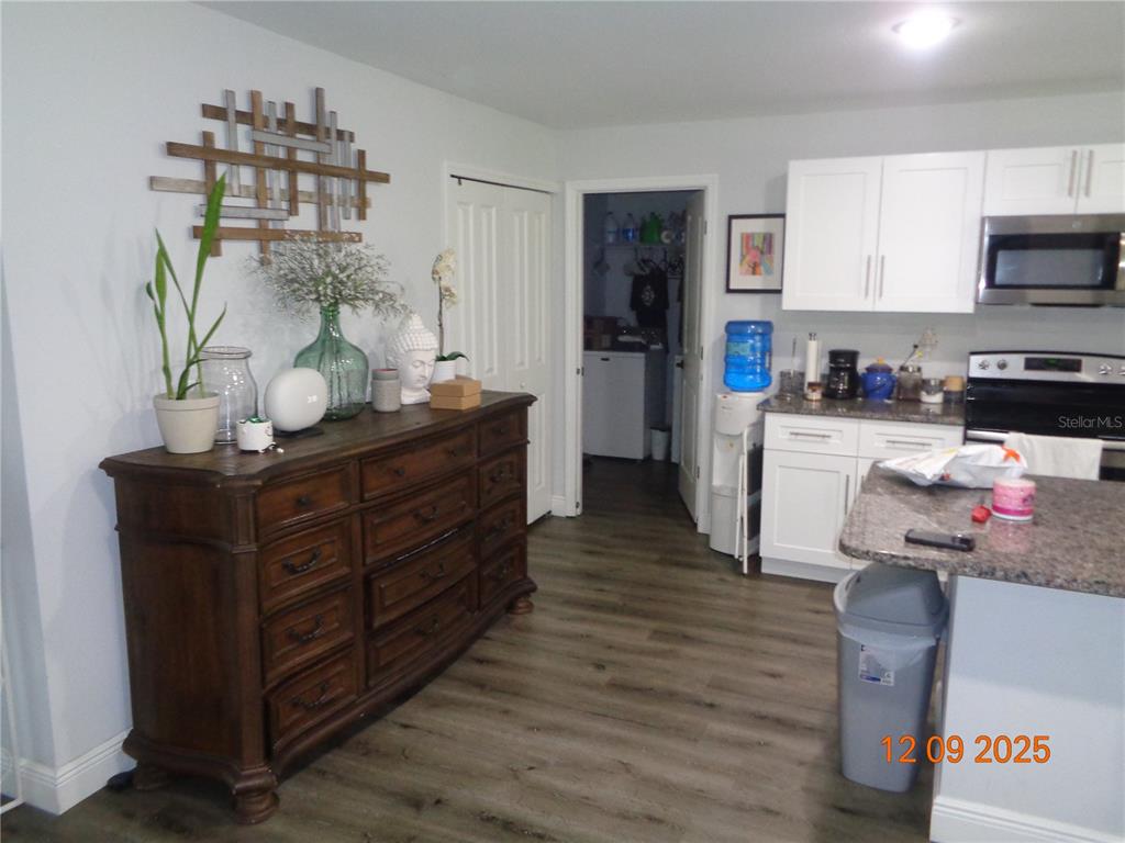 2380 8th Avenue DeLand, FL 32724 - Photo 21 of 31 a kitchen with stainless steel appliances granite countertop a refrigerator and a stove top oven