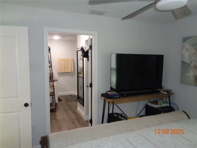 a bathroom with a shower and a sink