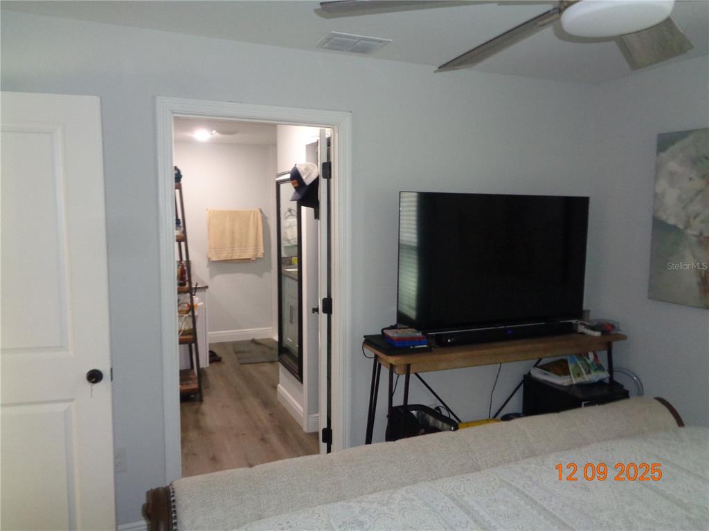 2380 8th Avenue DeLand, FL 32724 - Photo 28 of 31 a living room with furniture and a flat screen tv