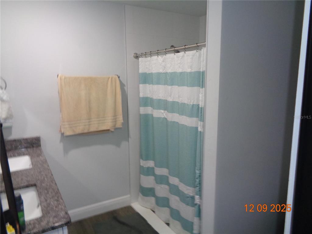 2380 8th Avenue DeLand, FL 32724 - Photo 29 of 31 a bathroom with a shower and a sink