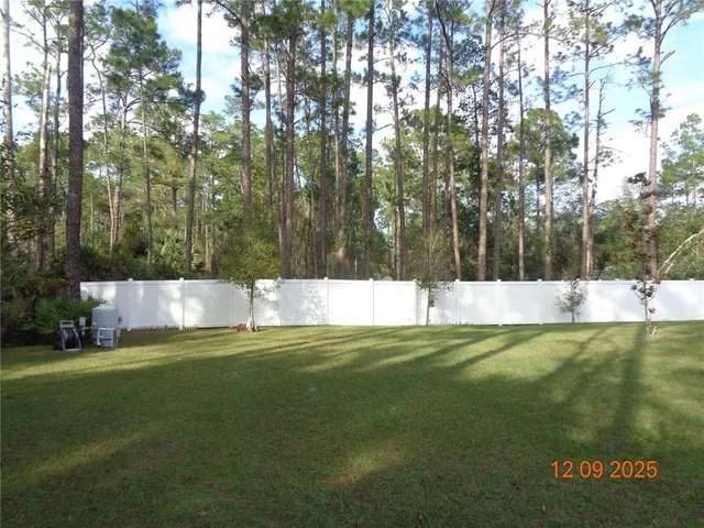 a view of front door and potted plants