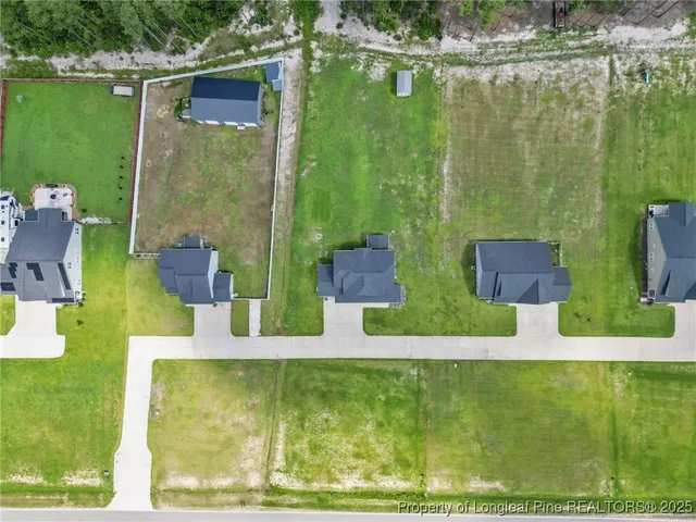 a view of a swimming pool with a yard