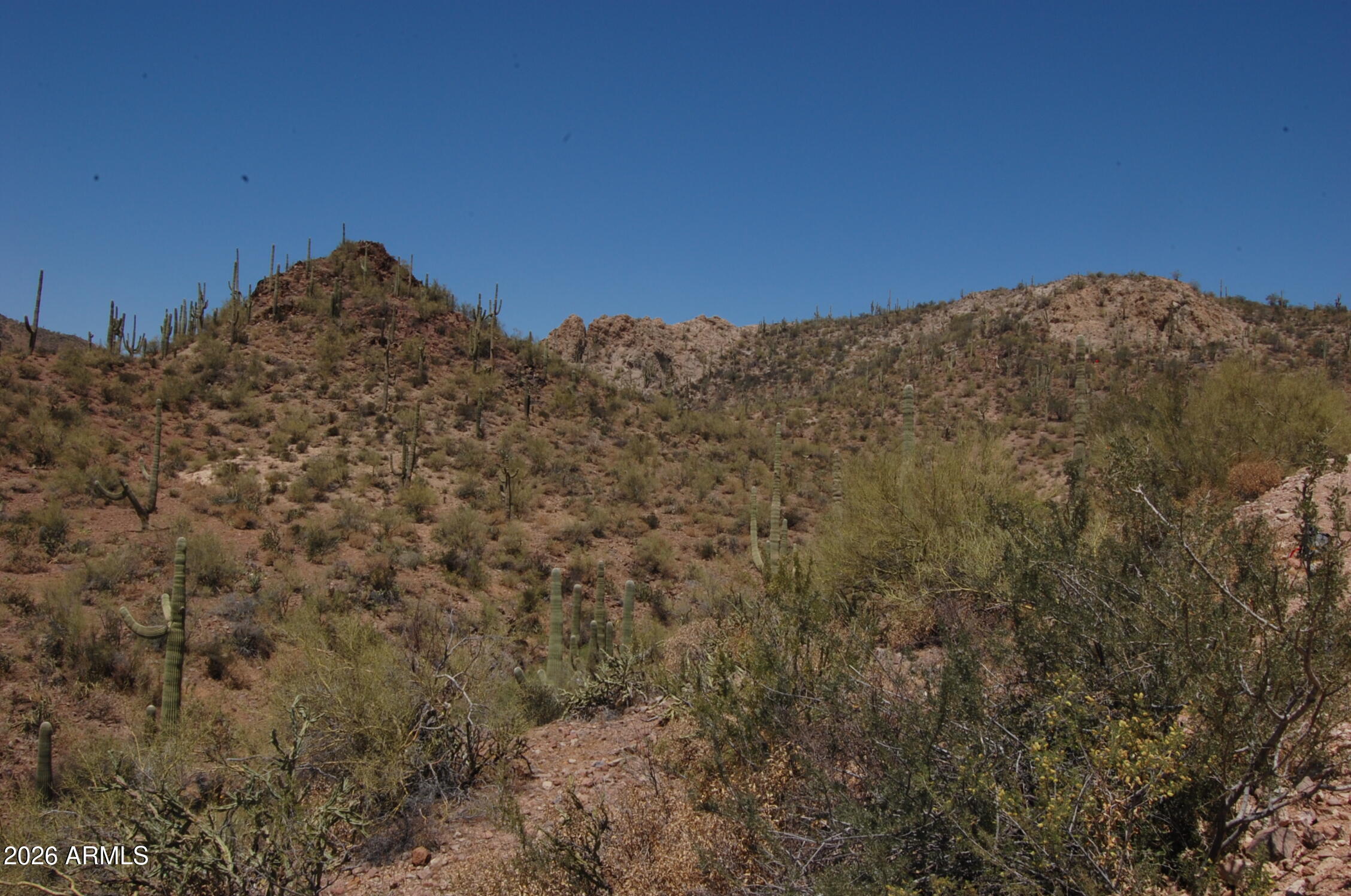 37700 Cow Creek Road, Unit 54 Morristown, AZ 85342 - Photo 14 of 42 a view of a large mountain with mountains in the background