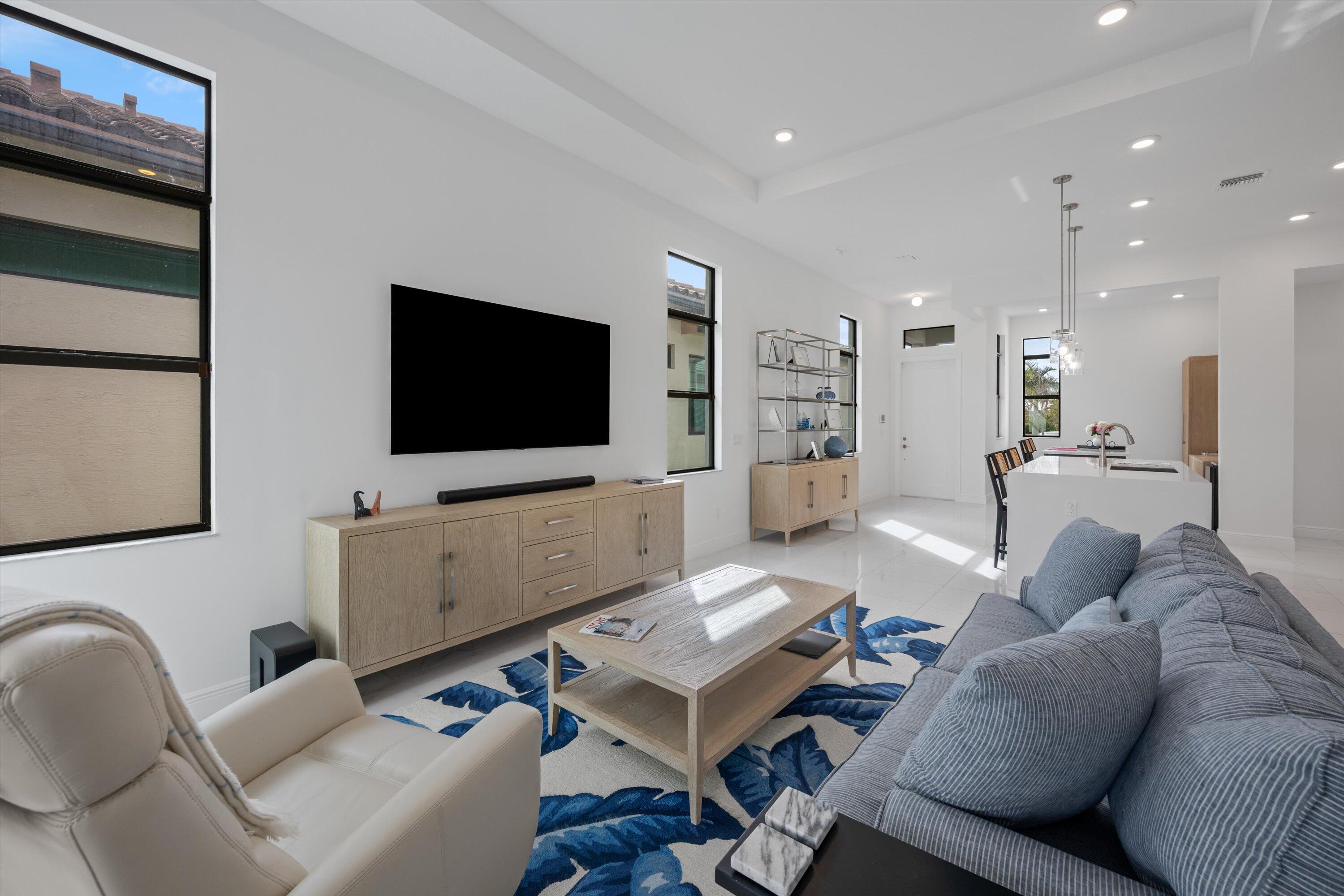 4891 Rivo Alto Circle Loxahatchee, FL 33470 - Photo 14 of 64 a living room with furniture and a flat screen tv