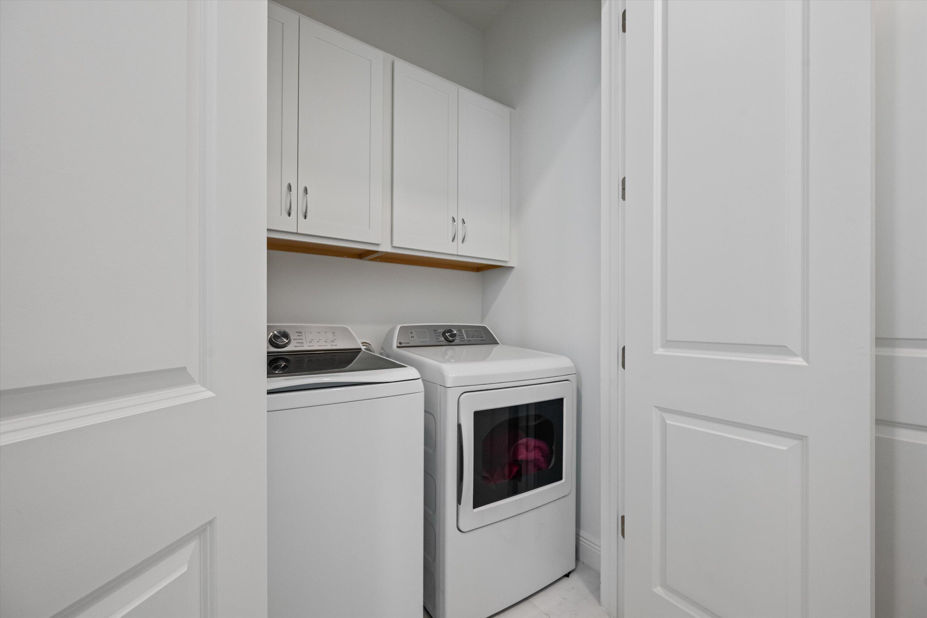 4891 Rivo Alto Circle Loxahatchee, FL 33470 - Photo 26 of 64 a close view of washer and dryer