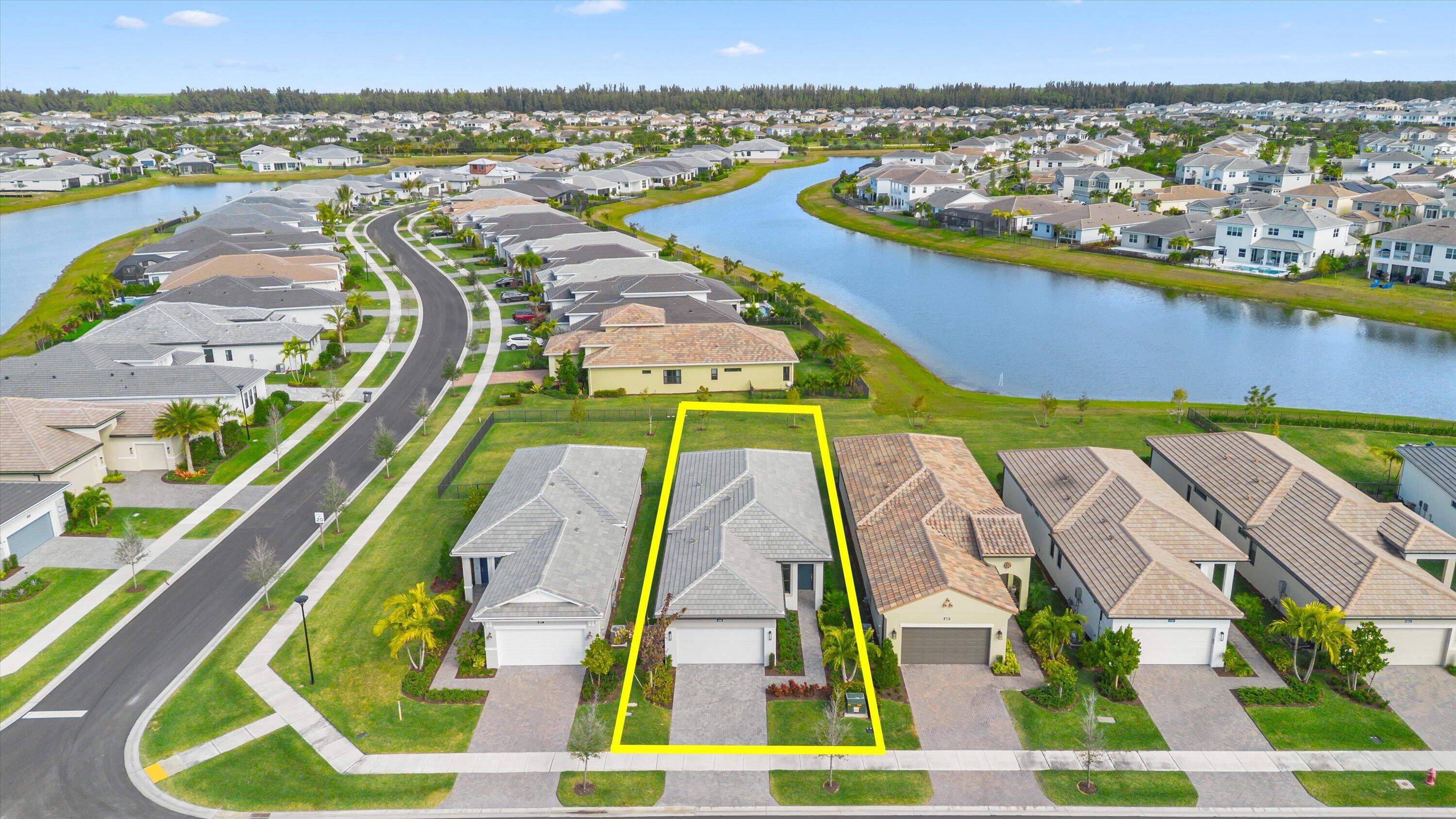 4891 Rivo Alto Circle Loxahatchee, FL 33470 - Photo 32 of 64 an aerial view of residential houses with outdoor space and swimming pool