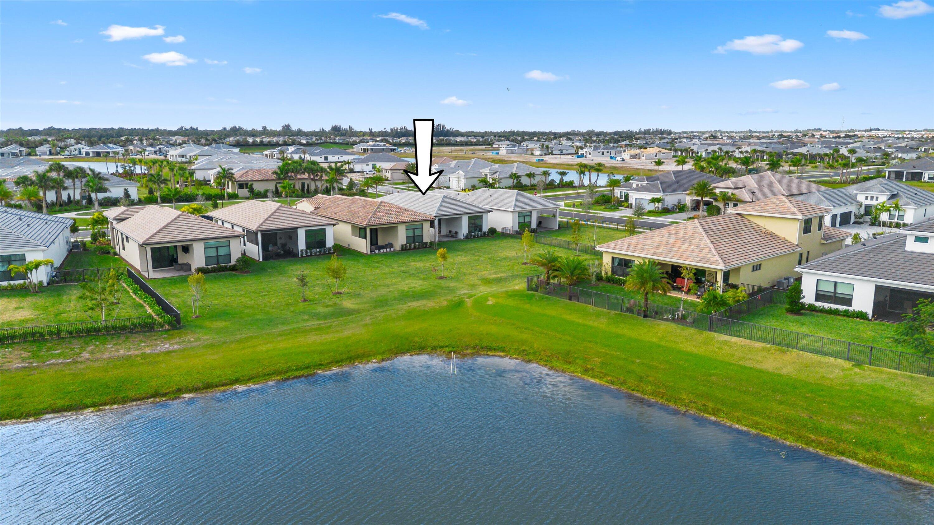 4891 Rivo Alto Circle Loxahatchee, FL 33470 - Photo 33 of 64 a view of a house with a yard and sitting area